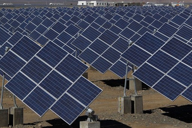 SOURCE OF DISPUTE. Large solar panels are seen in a solar power plant in Hami, northwest China's Xinjiang Uygur Autonomous Region on May 8, 2013. Photo by AFP