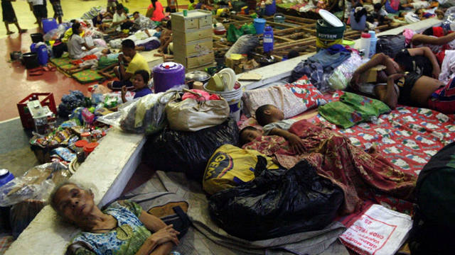 SHELTER. Evacuees sleep on the floor as they seek refuge inside a gymnasium turned into an evacuation center in Sorsogon City, Bicol region on Nov 7, 2013. Photo by Kit Recebido/EPA