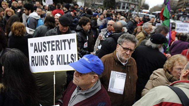 HARD TIMES. Hundreds of Spaniards march in Madrid's streets to demonstrate against austerity and debt-related measures, which have resulted in job cuts and home issues. Photo by AFP