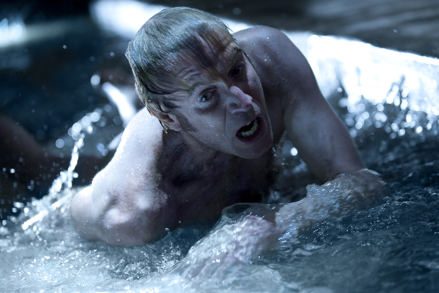 THAT’S DR. LIZARD TO YOU. Rhys Ifans manages to stay afloat  