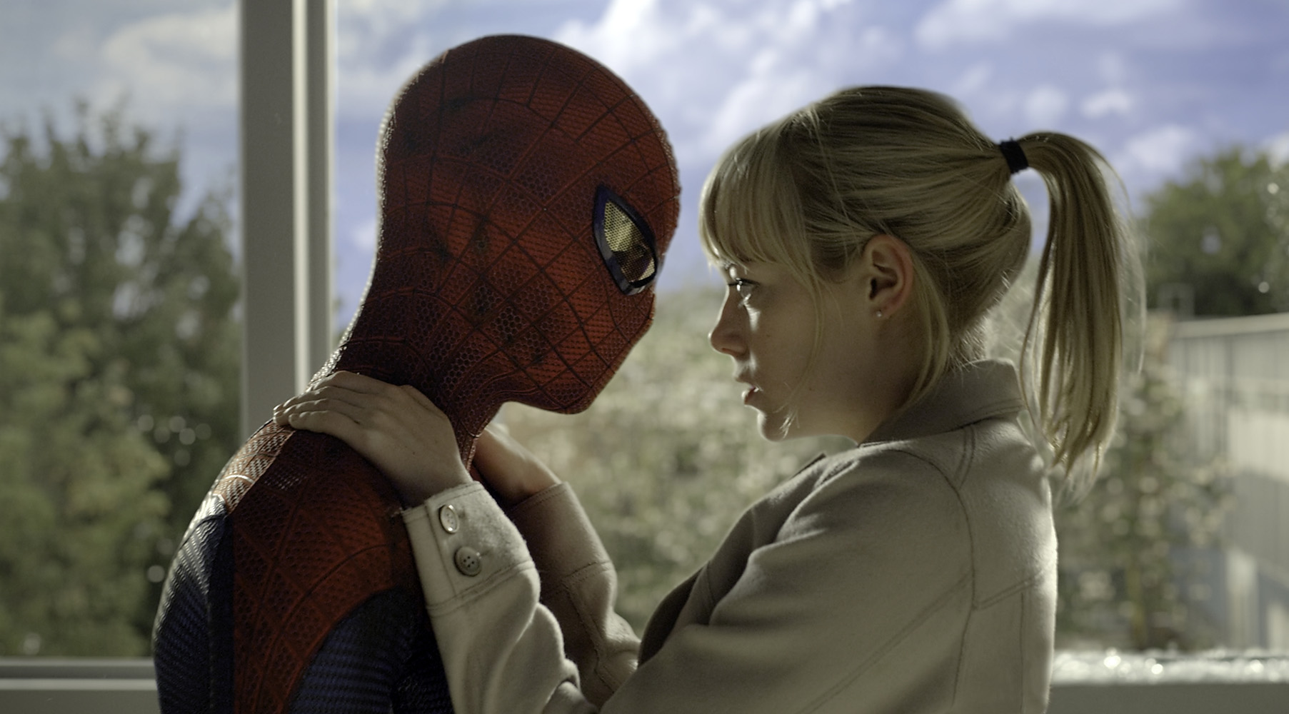 WHAT, NO UPSIDE-DOWN KISS? Spidey and Stacy get cozy. Movie stills from Columbia Pictures