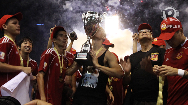 VICTORIOUS. Spanish Rufo Sanchez kisses the trophy after winning the UFL Cup. Photo by Josh Albelda.