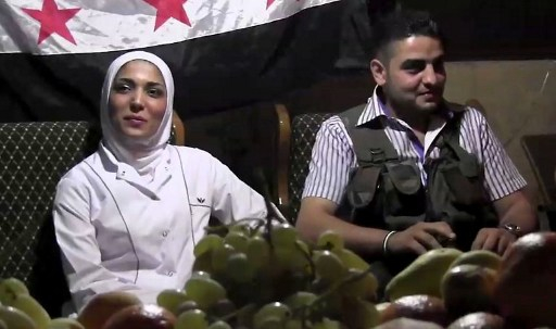 LOVE AND WAR. Syrian rebel sniper Abu Khaled sitting with his bride Hanan, the nurse who treated his leg wound, during their wedding ceremony in the Saif al-Dawla district of the northern city of Aleppo on August 31, 2012. Photo by AFP