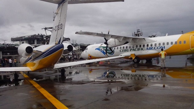 CONGESTED. The wing of a private jet parked at the Tacloban airport overlaps with a turboprop aircraft of Cebu Pacific due to limited space. Photo courtesy of CAAP deputy director general John Andrews