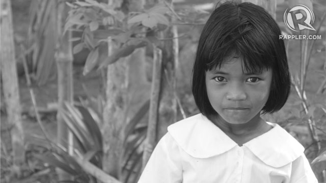 FIRST DAY. A girl from Brgy. De Carabao, land of the Tagbanuas, stops in her tracks to look at the camera. Photo by Jee Geronimo/Rappler