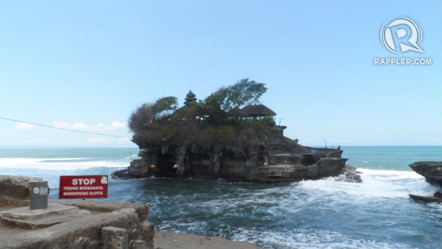 BY THE SEA.  The Tanah Lot provides such a dramatic backdrop for picture-taking.