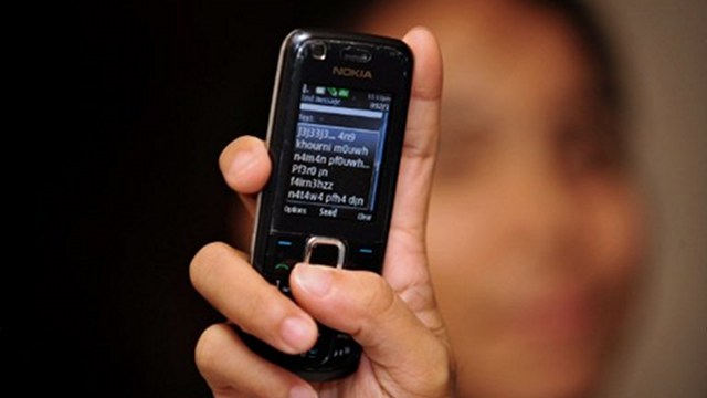 TEXT FEES. The Philippine regulator orders firms to reduce charges subscribers pay to send text messages. Photo by AFP 