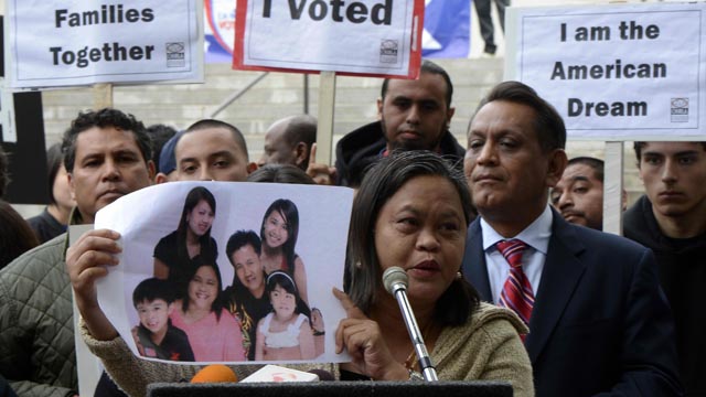 THE AMERICAN DREAM. Lolita from the Philippines holds a photograph of her family as she joined other immigrants who gathered in front of Los Angeles City Hall to press for immigration reform following the re-election of US President Barack Obama in Los Angeles, California, USA, 08 November 2012. EPA/Michael Nelson