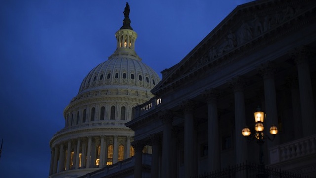 The U.S. Capitol illuminates at dusk on Capitol Hill on December 31, 2012 in Washington, DC. Drew Angerer/Getty Images/AFP
