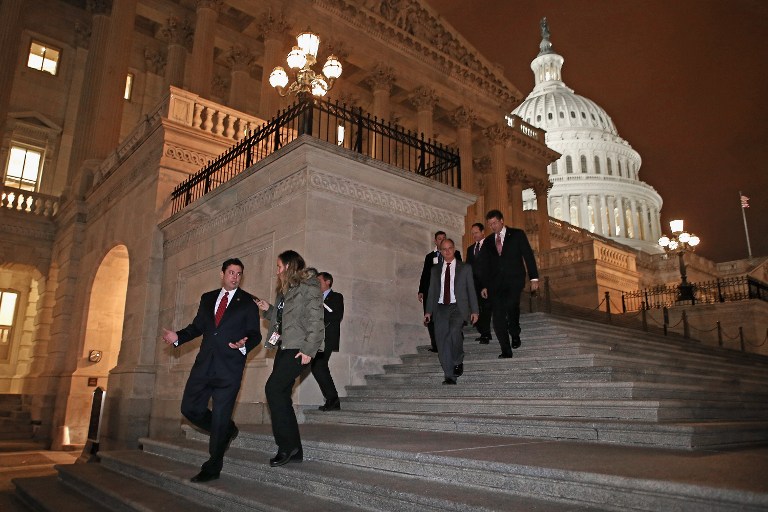 SAVED FROM THE EDGE. Members of the House of Representatives, including Rep. Jason Chaffetz (R-UT) (L), leave after voting for legislation to avoid the "fiscal cliff" during a rare New Year's Day session January 1, 2013 in Washington, DC. Voting 257-167, the House passed a bill that the Senate passed the night before, clearing the way for President Barack Obama to sign the legislation to avoid the "fiscal cliff." Chip Somodevilla/Getty Images/AFP