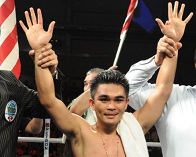 VICTORIOUS. Philippine boxer Brian "Hawaiian Punch" Viloria beat Mexican Hernan "Tyson" Marquez on Sunday, November 17. Photo by AFP