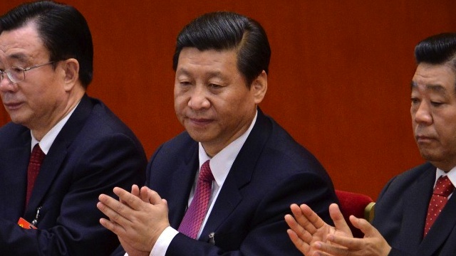 LEADER-IN-WAITING. Chinese Vice President Xi Jinping (C) applauds during the closing of the 18th Communist Party Congress at the Great Hall of the People in Beijing on 14 November 2012. AFP PHOTO/WANG ZHAO