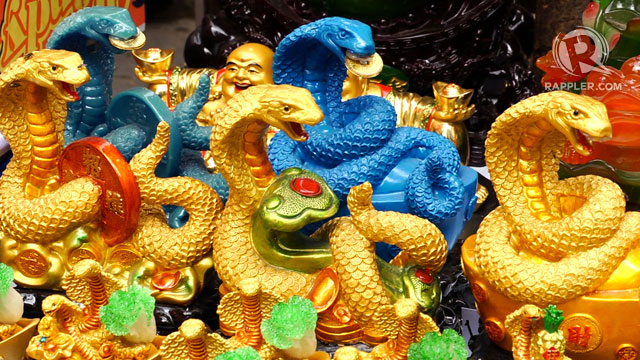 SNAKE CHARM-ERS. Water Snake figurines are the choice souvenirs this Chinese New Year