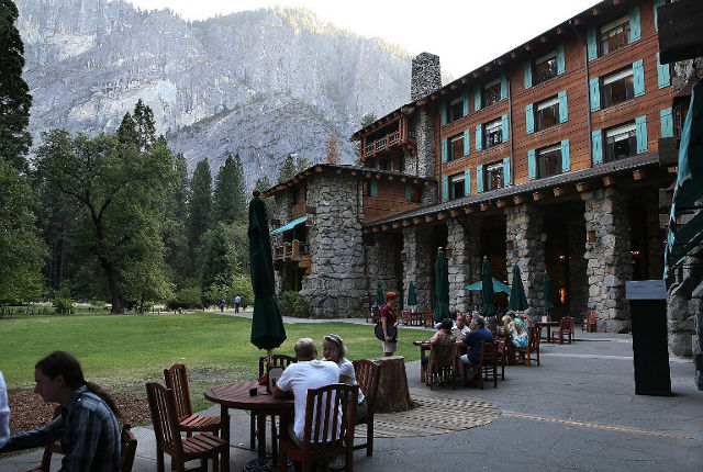 YOSEMITE. Park visitors sit outside of the Ahwahnee Hotel on August 28, 2013 in Yosemite National Park, California. Justin Sullivan/Getty Images/AFP
