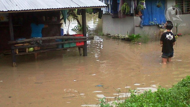 RISING WATERS. Residents in flooded barangays are seeking refuge in evacuation centers across Zamboanga City. Photo by Richard Falcatan