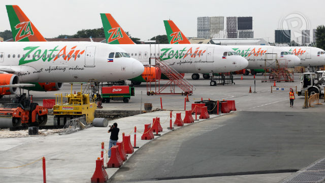NO FLIGHTS. Zest Air's fleet of A320s are parked in NAIA Terminal 4 following CAAP's suspension. Photo by Rappler