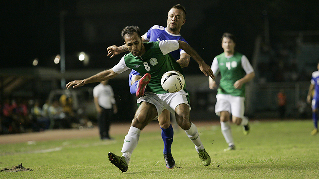 FROM BEHIND. Stephan Schrock attempts to steal the ball from a TKM booter. Photo by Josh Albelda/RAPPLER