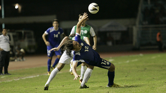 JOSTLING FOR POSITION. Angel Guirado tries to take control of the ball against a TKM defender. Photo by Josh Albelda/RAPPLER