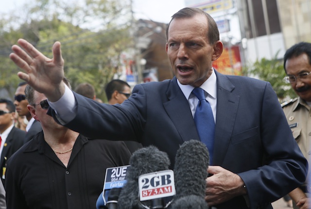 AGAINST CARBON TAX. In this file photo, Australian Prime Minister Tony Abbott speaks to the media in front of the Bali bombing memorial after laying a wreath at the memorial to those killed in the 2002 Bali bombing, in Kuta, Bali, Indonesia, 09 October 2013. EPA/Made Nagi