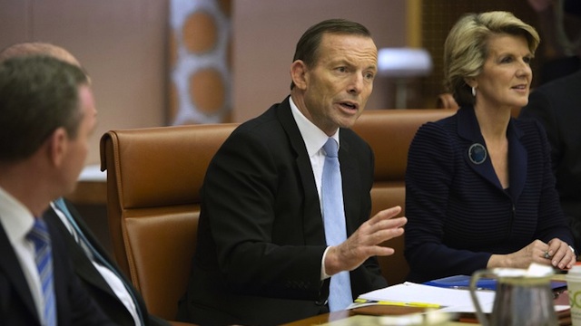 'SEXISM' AWARD. Australian Prime Minister Tony Abbott  (C) chairs the first meeting of the full ministry at Parliament House in Canberra on September 18, 2013. AFP/Pool/Penny Bradfield
