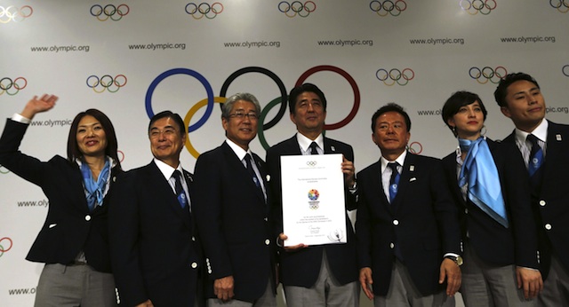 WINNING BID. Japanese Prime Minister Shinzo Abe (C) poses with the delegation members after the presentation of the Tokyo 2020 Olympic candidature at the 125th International Olympic Committee (IOC) session, in Buenos Aires, Argentina, 07 September 2013. EPA/Daniel Jayo