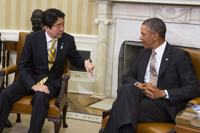 In this file photo, US President Barack Obama (R) and Japanese Prime Minister Shinzo Abe (L) talk to each other during a conference with members of the media in the Oval Office in the White House in Washington, DC, USA, 22 February 2013. Photo by Kristoffer Tripplaar/EPA