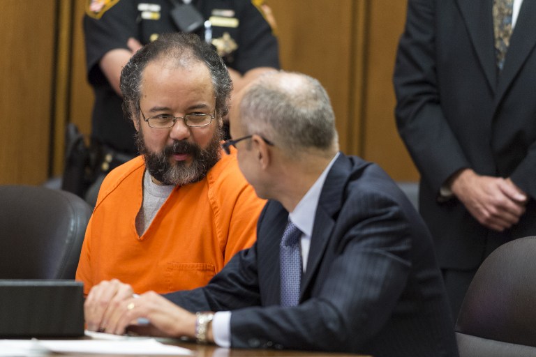 In this file photo, Ariel Castro (L) talks with his lawyer during a break in his trial on August 1, 2013 in Cleveland, Ohio. Angelo Merendino/Getty Images/AFP