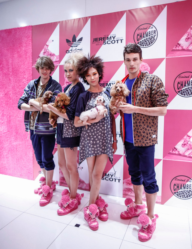 FOR MEN AND WOMEN. Models rock the JS Poodle shoes while carrying the inspiration behind them. These poodles are from Voices of Animals. Photo courtesy of ICON International