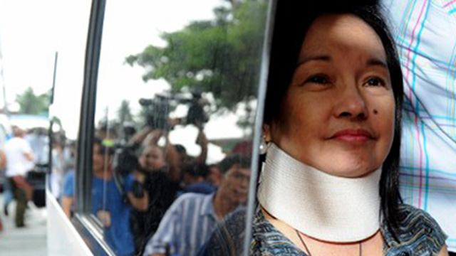 HOME. Arroyo smiles faintly as she arrives at her home in La Vista Subdivision in Quezon City. AFP Photo