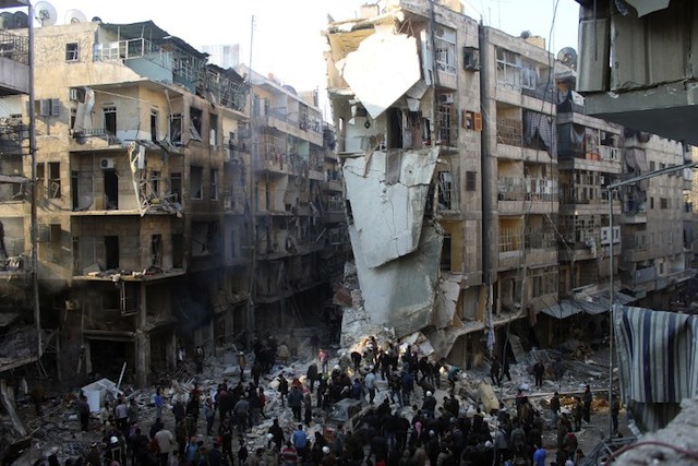 THE VIOLENCE CONTINUES. Syrians search for survivors amidst the rubble following an airstrike in the Shaar neighborhood of Aleppo on December 17, 2013. AFP/Mohammed al-Khatieb
