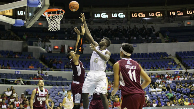 Alfred Aroga of NU goes to the rim for two points. Photo by Mark Cristino
