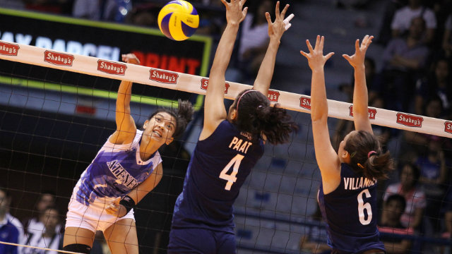 ROAD TO THE TITLE. Alyssa Valdez of Ateneo spikes the ball past Adamson defenders during a March 23 game. Photo by Josh Albelda/Rappler