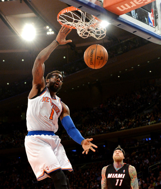 THROWING IT DOWN. New York Knicks Amar'e Stoudemire throws down an emphatic dunk as Miami Heat Chris Andersen can only look on Thursday, Jan. 9 at Madison Square Garden. The Knicks won 102-92. Photo by Justin Lane/EPA