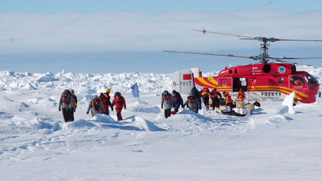 MISSION COMPLETE. On  January 2, 2014, passengers who spent Christmas and New Year trapped on a Russian research vessel in Antarctica disembark from a rescue helicopter after they were airlifted from the ice. Photo from Agence France-Presse/Jessica Fitzpatrick/Australian Antarctic Division