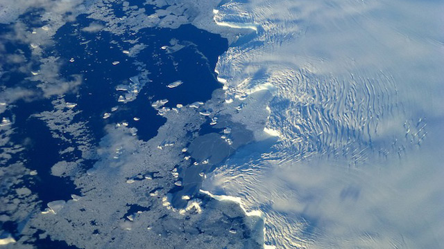 MELTING FAST. Edge of an ice shelf in Adelaide Island, off the Antarctic Peninsula. NASA / Maria-Jose Vinas