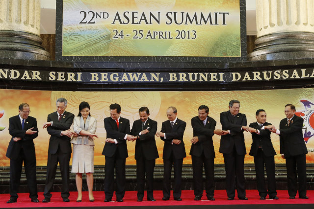 JOINING HANDS. President Benigno Aquino III (first from left) joins other Southeast Asian leaders at the 22nd ASEAN Summit last April. Photo by EPA/Made Nagi