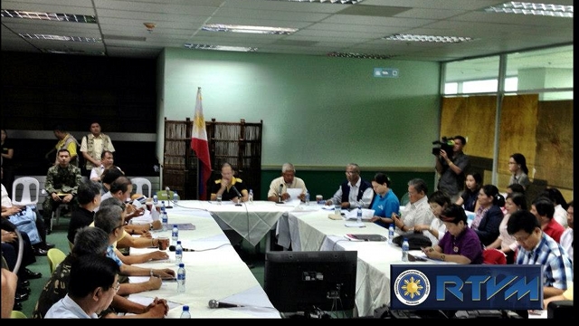DISASTER BRIEFING. Aquino meets with disaster officials and his Cabinet at the Davao International Airport. to map out the response to Typhoon Pablo. Photo from RTVM 