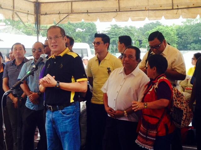 ASSURANCE. President Benigno Aquino III (3rd L) speaks to evacuees at the CPG Sports Complex in Tagbilaran City, Bohol, 16 October 2013. Photo courtesy of the DSWD Twitter account @dswdserves