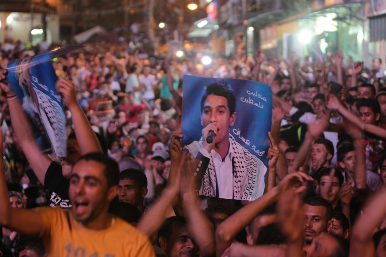 'IDOL' CELEBRATIONS. Thousands of Palestinians from the city of Ramallah celebrating the victory in the Arab Idol contestant of Mohammed Assaf from Gaza City in the West Bank city of Ramallah June 23, 2013. Photo by AFP/Abbas Momani