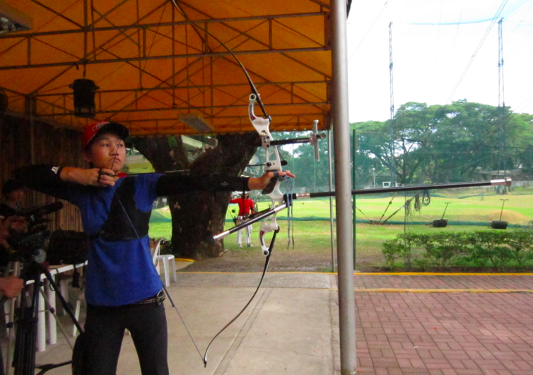 EYE ON THE TARGET. Bianca Gotuaco, Archer and Palarong Pambansa athlete shooting a Recurve bow.