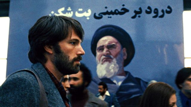 ICONS BOTH. Ben Affleck and a familiar figure in a re-imagined 1979 Tehran. All movie stills from Warner Bros. Pictures