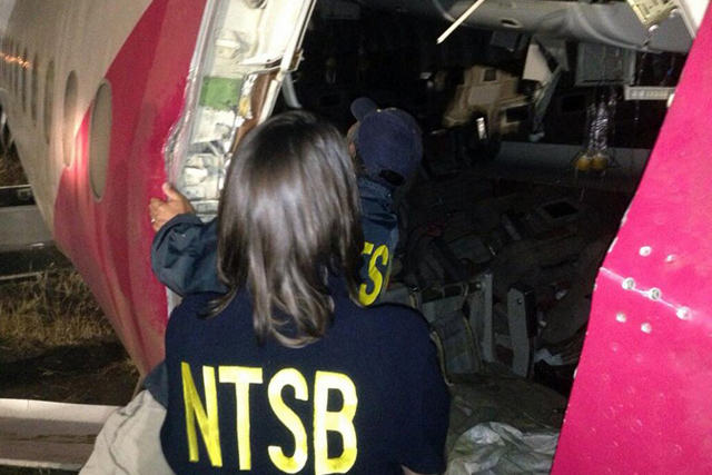 INSPECTION. National Transportation Safety Board Chairman Deborah Hersman and Investigator-in-Charge Bill English looking at interior damage to Asiana Flight 214 during their first site assessment in San Francisco, California. Photo by AFP/Handout/NTSB