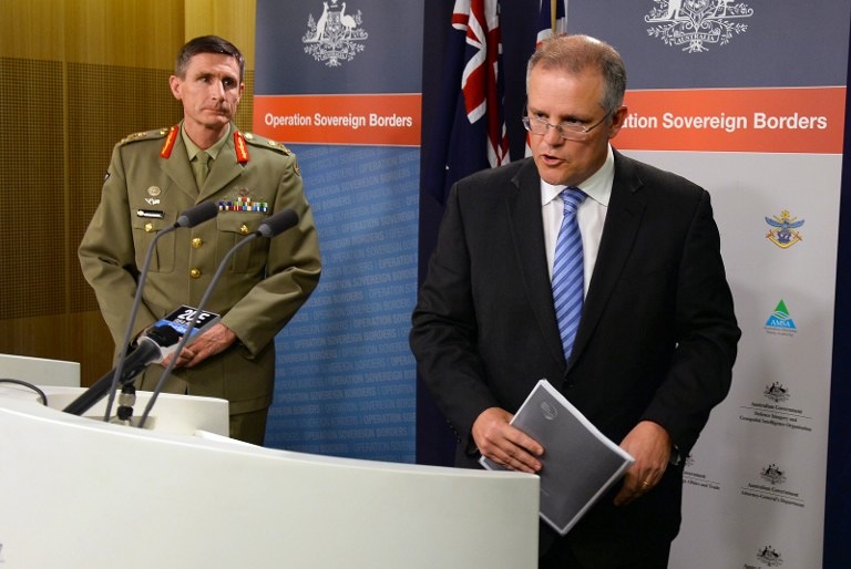 'SOVEREIGN BORDERS.' Australian Minister for Immigration and Border Protection Scott Morrison (R) and Lt Gen Angus Campbell (L), commander of the federal government's Operation Sovereign Borders policy, speak during a press conference in Sydney on September 23, 2013. AFP/William West