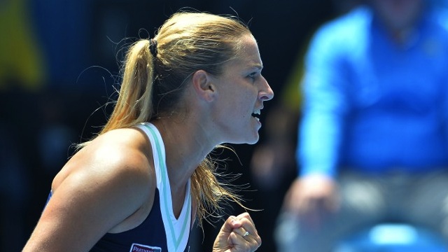 VICTORY. Slovakia's Dominika Cibulkova shouts during her women's singles match against Russia's Maria Sharapova on day eight of the 2014 Australian Open tennis tournament in Melbourne on January 20, 2014. Paul Crock/AFP