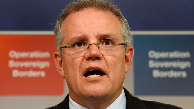 ASYLUM SOLUTION. Australian Immigration Minister Scott Morrison at a press conference in Sydney on September 30, 2013. AFP PHOTO/William WEST