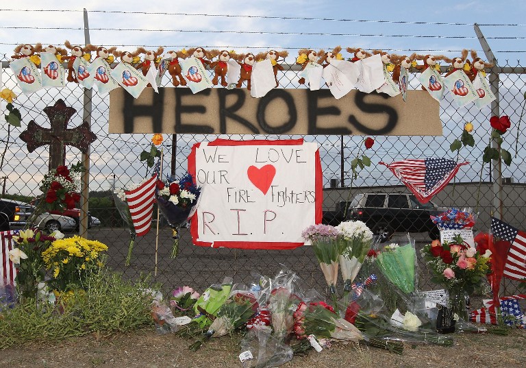 'HEROES.' A make shift memorial and a sign reading "Heroes" is displayed outside of Station 7 on July 1, 2013 in Prescott, Arizona. Christian Petersen/Getty Images/AFP