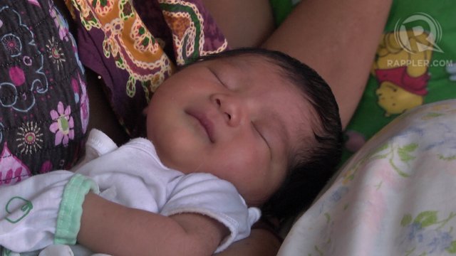MAIN MOTIVATION. Three-day-old Queen Angel Maitim was born in Cebu City when the Maitim couple made it out of Tacloban. She was their main motivation to survive the fury of Super Typhoon Yolanda (Haiyan). Photo by Franz Lopez/Rappler