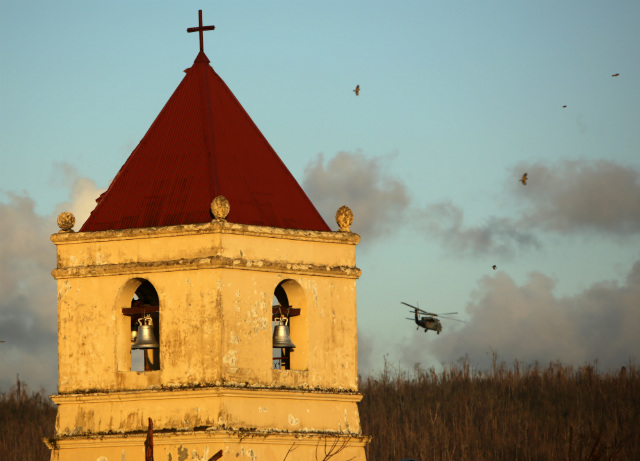 ICONIC BELLS MISSING. A view of a historic Balangiga Church as a US Navy Sea Hawk helicopter flies over in the Haiyan-devastated town of Balangiga, Eastern Samar on Nov 18, 2013. File photo by Francis Malasig/EPA