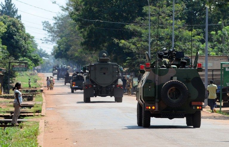 PATROLLING BANGUI. Soldiers of the African-led International Support Mission to the Central African Republic (MISCA) patrol in the streets of Bangui on December 7, 2013. AFP / Sia Kambou