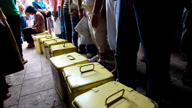 GETTING READY. Election officials wait for their assigned poll materials in Lian municipal office in Batangas on October 28, 2013. Photo by Dennis Sabangan / EPA